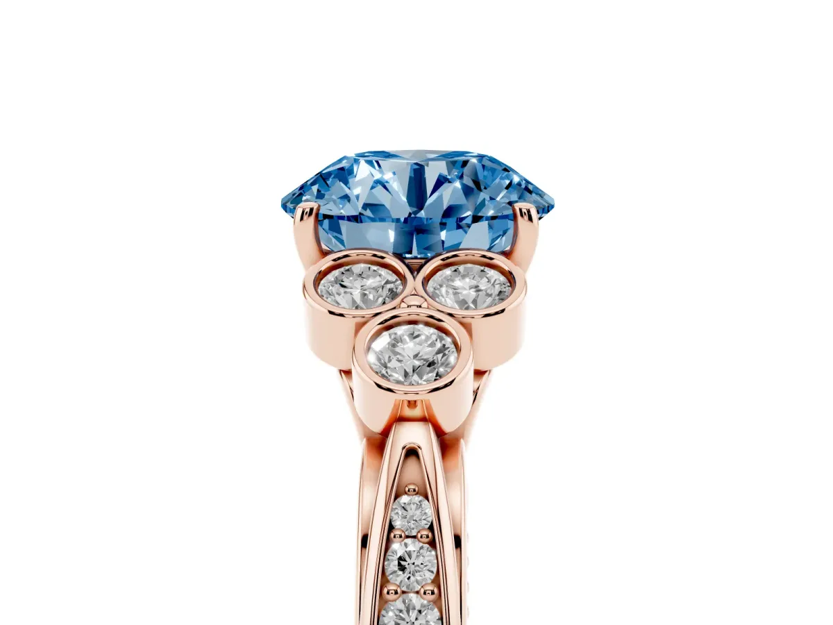 Fancy Blue Round Cut Cut Diamond Engagement Ring with Bezel Set Round Side Stones and Prong Setting Rose gold