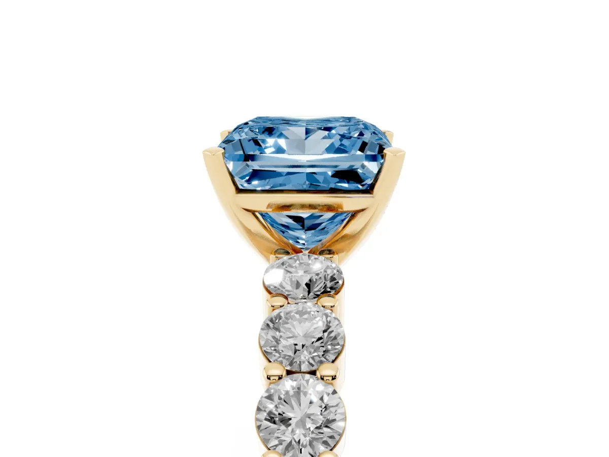 Fancy Blue Princess Cut Diamond Solitaire Ring with Shared Prong Round Side Stones Yellow gold