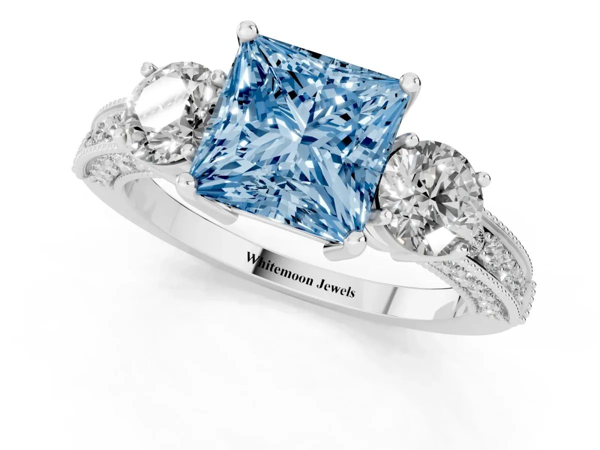 Fancy Blue Princess Cut Three-Stone Diamond Ring with Pavé Band and Four-Prong Setting Silver