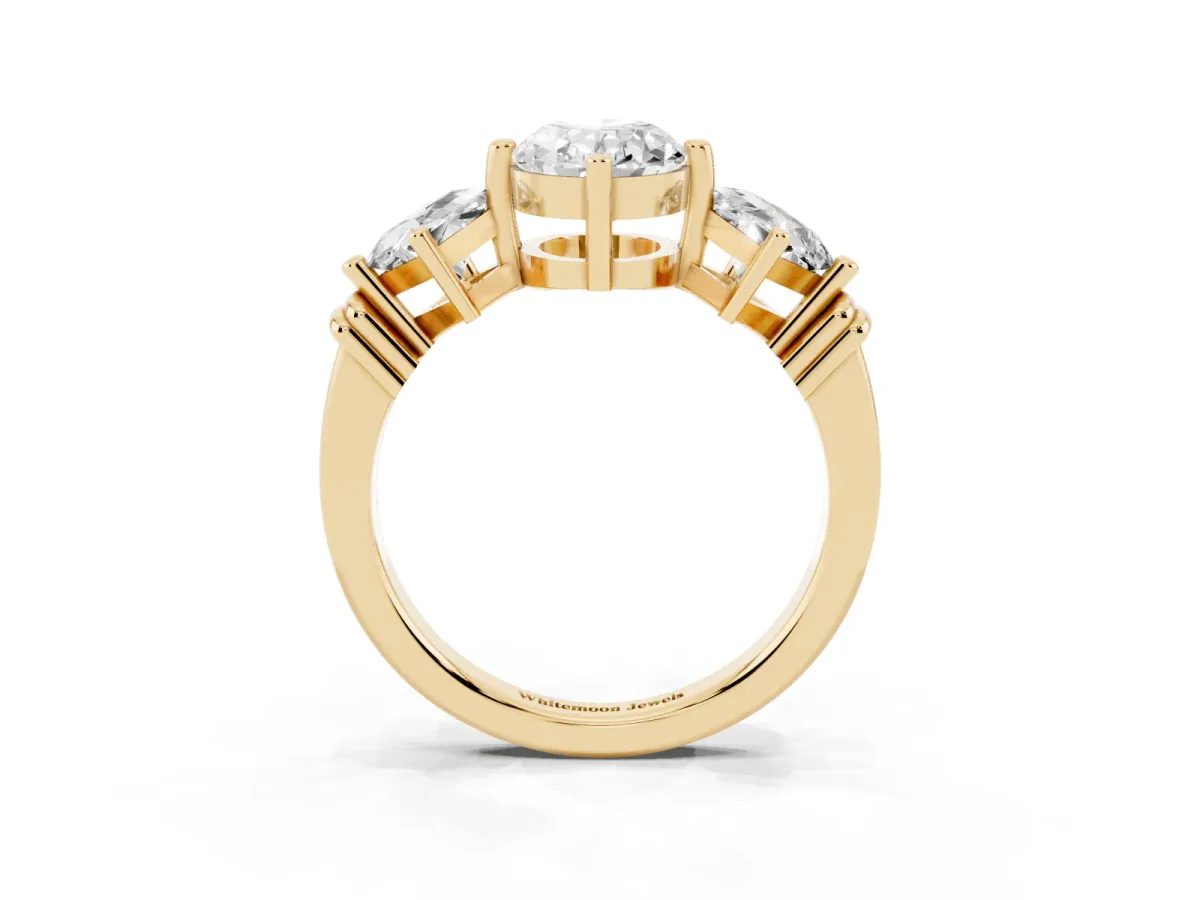 Three-Stone Oval Cut and Princess Cut Diamond Ring with Channel Band and Four-Prong Setting Yellow gold