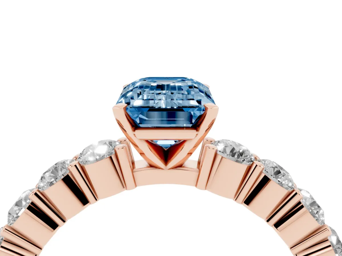 Fancy Blue Emerald Cut Diamond Solitaire Ring with Shared Prong Round Side Stones Rose gold