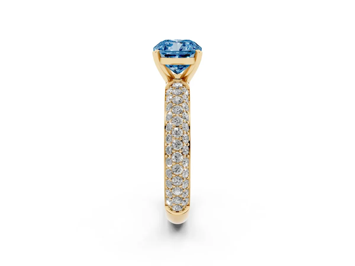 Fancy Blue Cushion Cut Diamond Solitaire Ring with Prong Setting and Pavé Band Yellow gold
