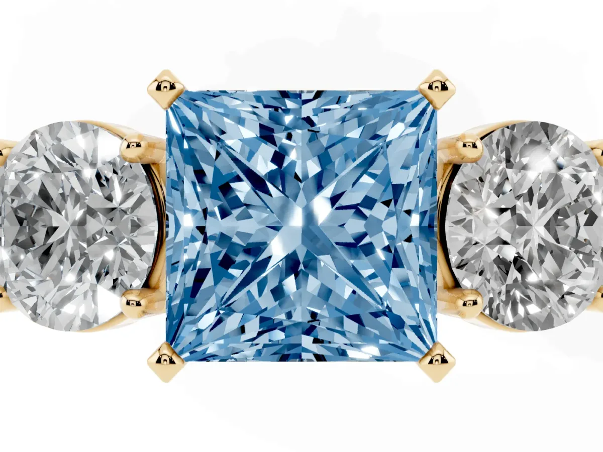 Fancy Blue Three-Stone Princess Cut Diamond Ring with Round Side Stones, Classic Band, and Four-Prong Setting Yellow gold
