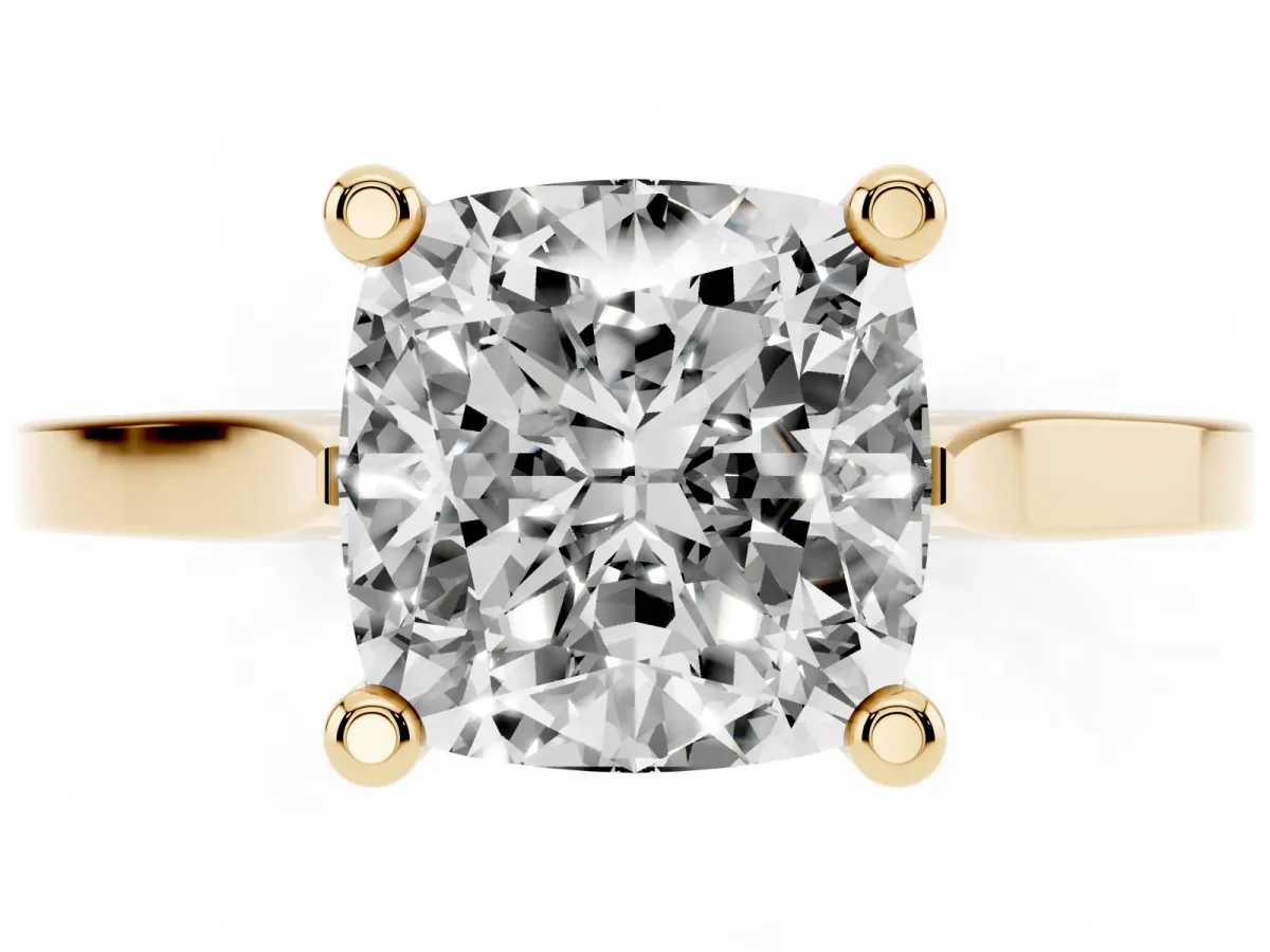 Cushion Cut Solitaire Diamond Ring with Four-Prong Setting and Tapered Band Yellow gold