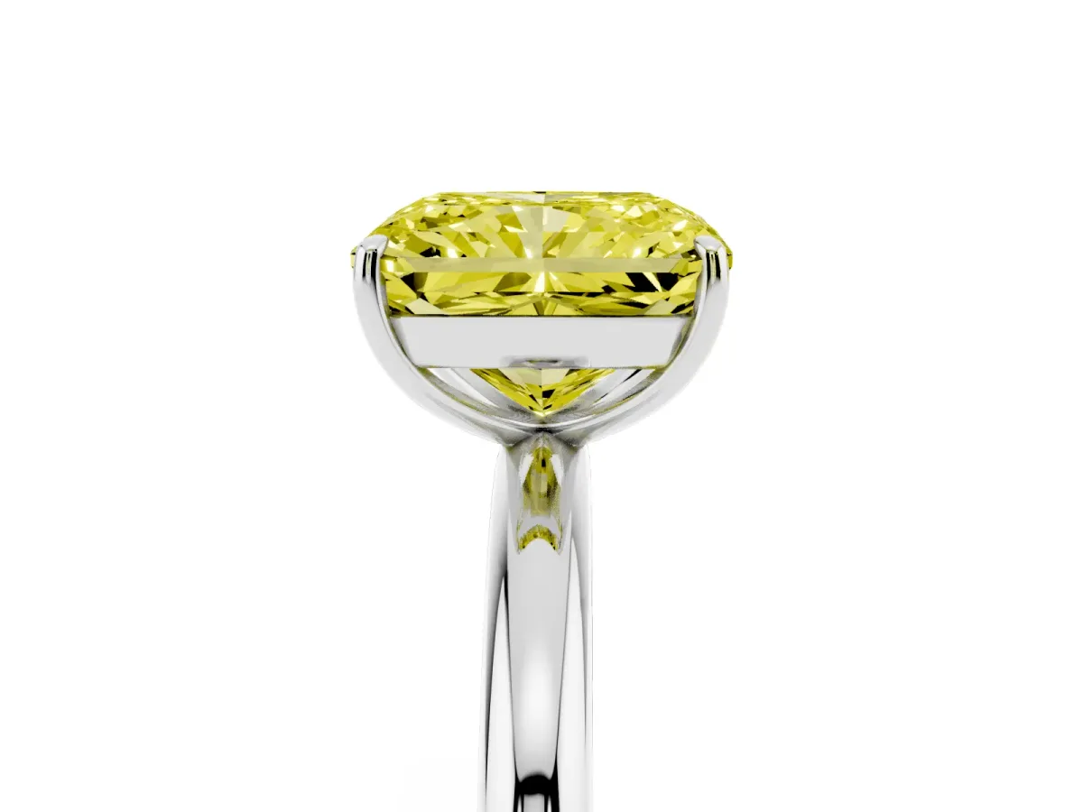 Fancy Yellow Radiant Cut Solitaire Diamond Ring with Four-Prong Setting on a Plain Band Platinum