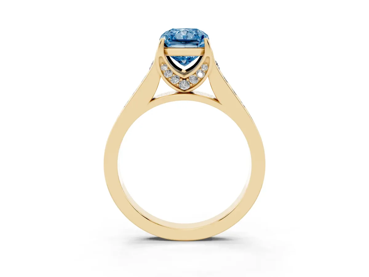 Fancy Blue Radiant Cut Brilliant Cut Diamond Engagement Ring with Pavé Band and Four-Prong Setting Yellow gold