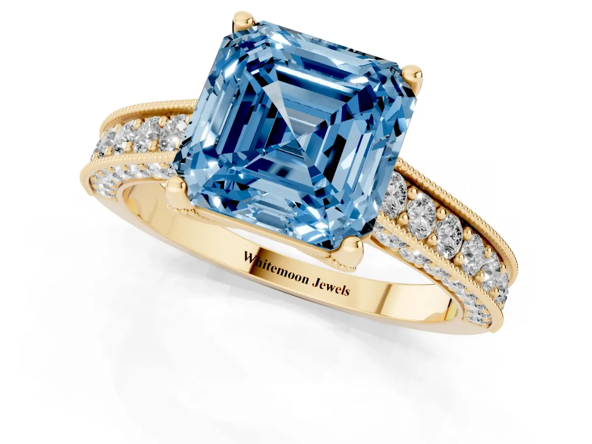 Fancy Blue Asscher Cut Cut Diamond Solitaire Ring with Milgrain Pave Band and Four Prong Setting Yellow gold