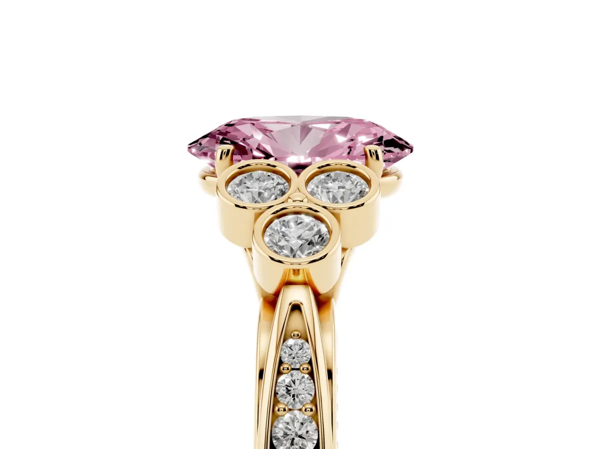 Fancy Pink Oval Cut Cut Diamond Engagement Ring with Bezel Set Round Side Stones and Prong Setting Yellow gold