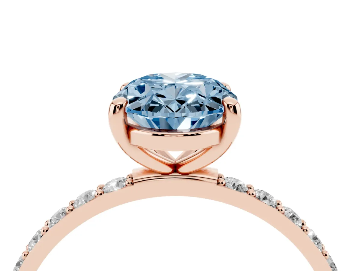 Fancy Blue Oval Cut Diamond Solitaire Ring with Round Pavé Band and Prong Setting Rose gold