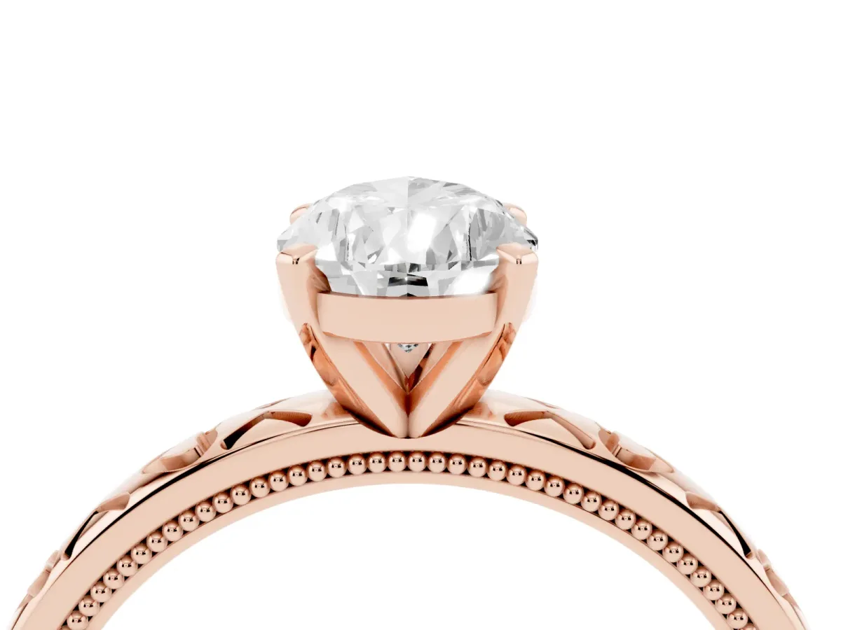 Pear Cut Solitaire Diamond Engagement Ring with XO Engraved Band and Four-Prong Setting Rose gold