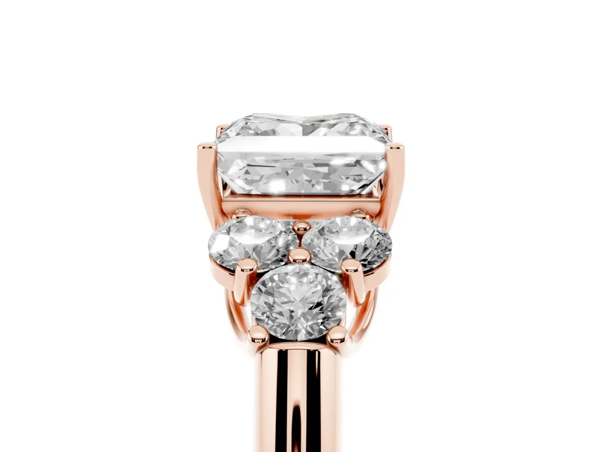 Princess Cut Cut Diamond Cluster Ring with Round Accent Stones and Prong Setting on a Classic Band Rose gold