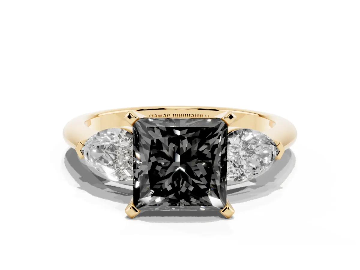 Fancy Black Three-Stone Princess Cut Diamond Ring with Pear Side Stones and Four-Prong Setting Yellow gold