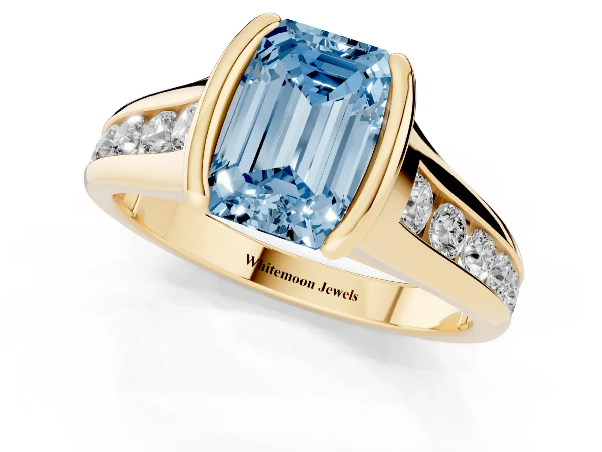 Fancy Blue Emerald Cut Solitaire Bezel-Set Diamond Ring with Channel-Set Band Yellow gold