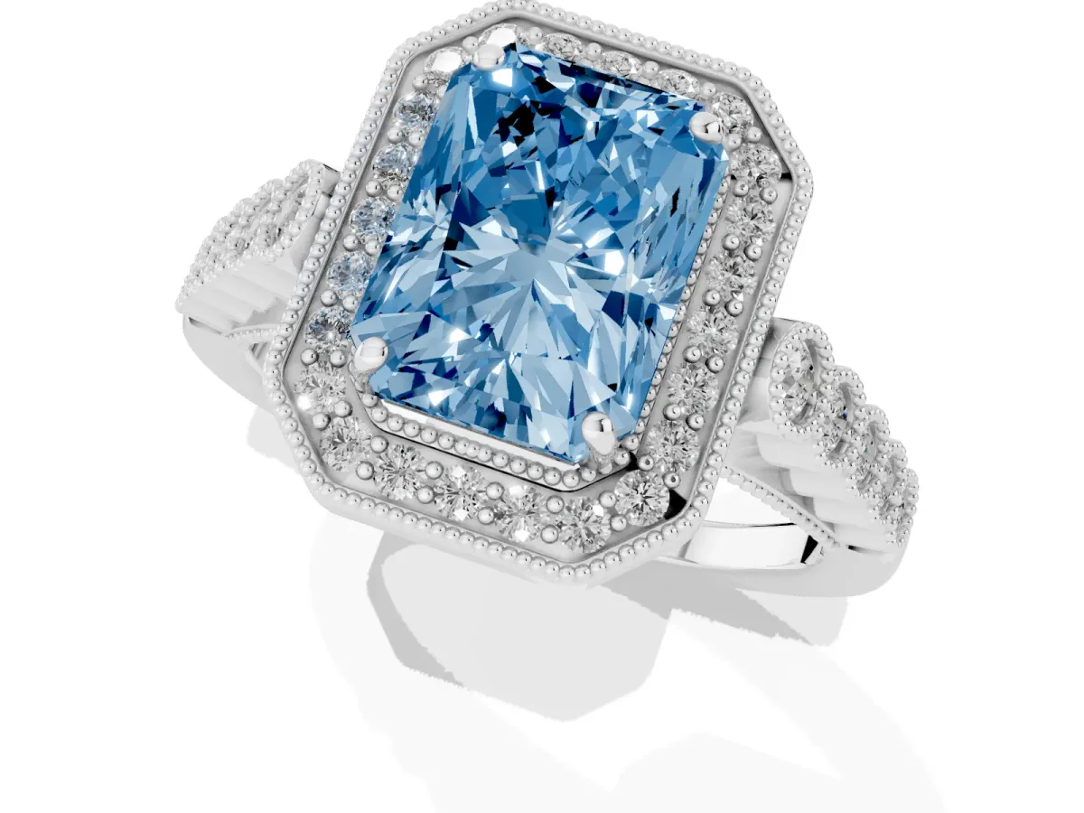Fancy Blue Radiant Cut Halo Milgrain Solitaire with Bezel Set Side Stones and Pave Band White gold