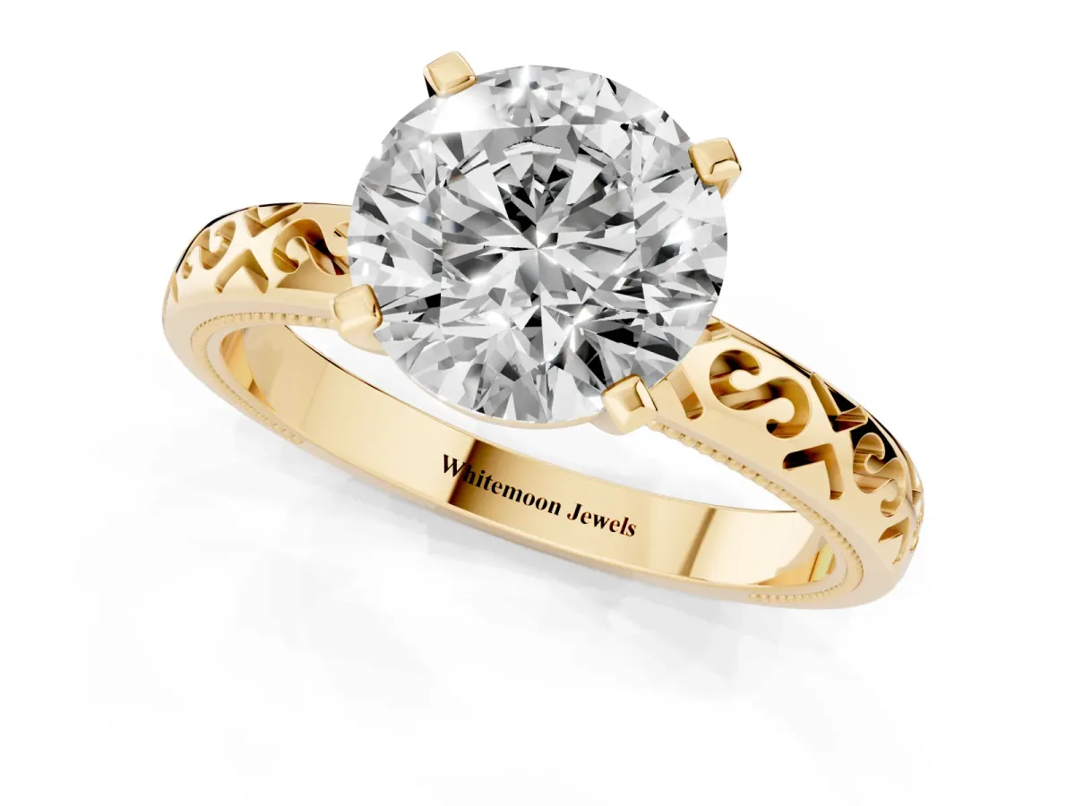 Round Cut Solitaire Engagement Ring with Scrollwork Band and Four-Prong Setting Yellow gold