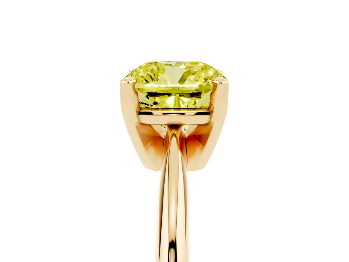 Fancy Yellow Cushion Cut Cut Solitaire Ring with Four-Prong Setting on a Classic Band Yellow gold