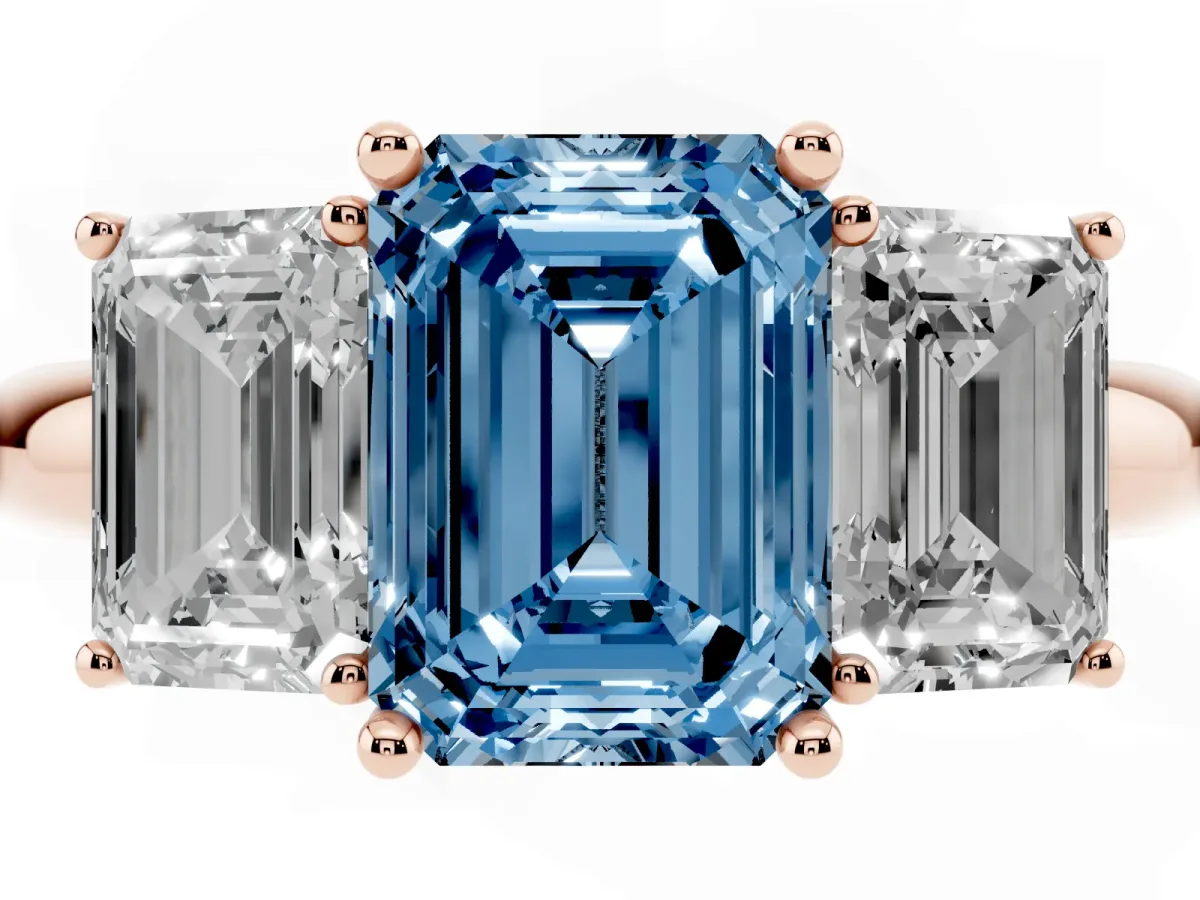 Fancy Blue Three-Stone Emerald Cut Cut Diamond Engagement Ring with Prong Setting on a White Gold Band Rose gold
