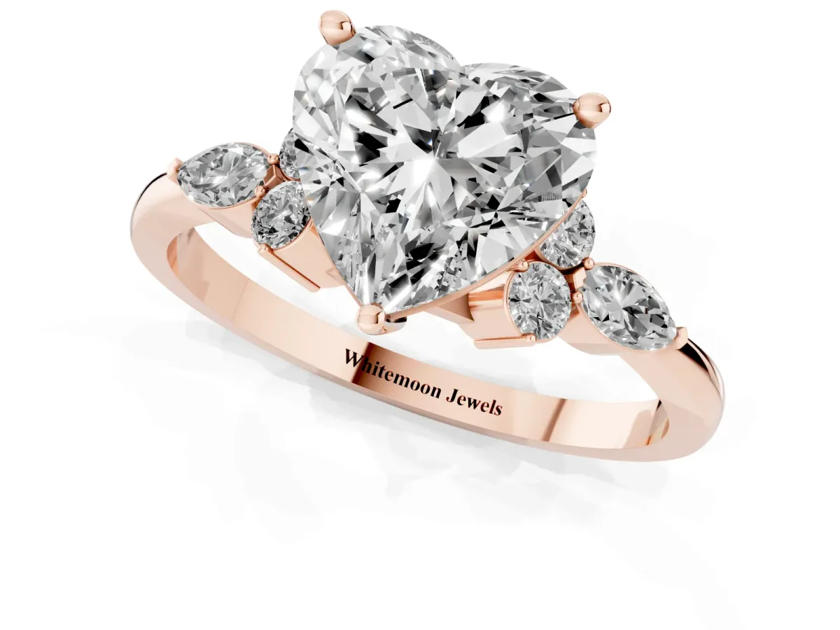 Heart Cut Brilliant Diamond Solitaire Ring with Pear Side Stones and Four-Prong Setting Rose gold