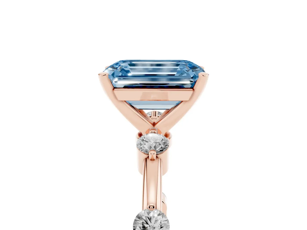Fancy Blue Emerald Cut Solitaire Diamond Ring with Bezel Set Side Stones and Prong Setting Rose gold