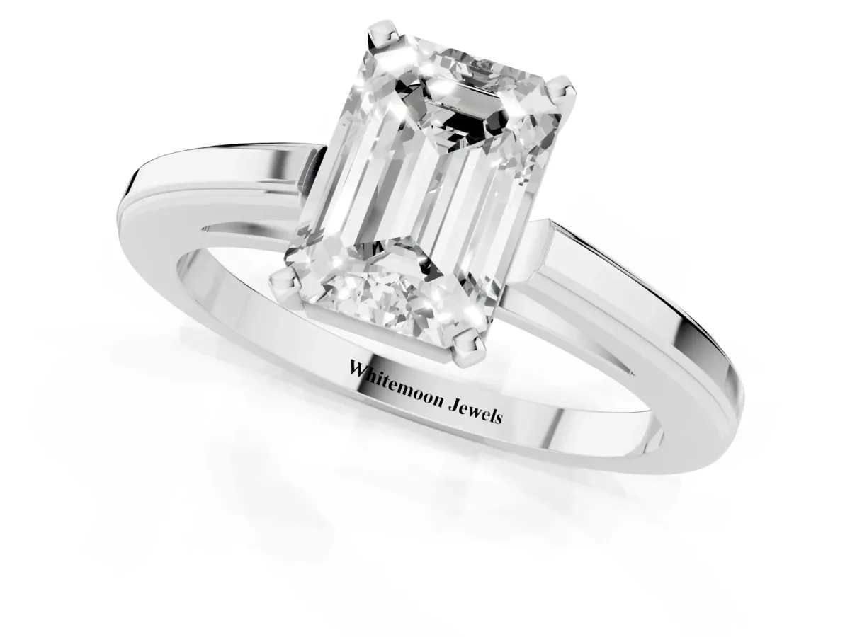 Emerald Cut Solitaire Diamond Ring with Four-Prong Setting and Classic Band Platinum
