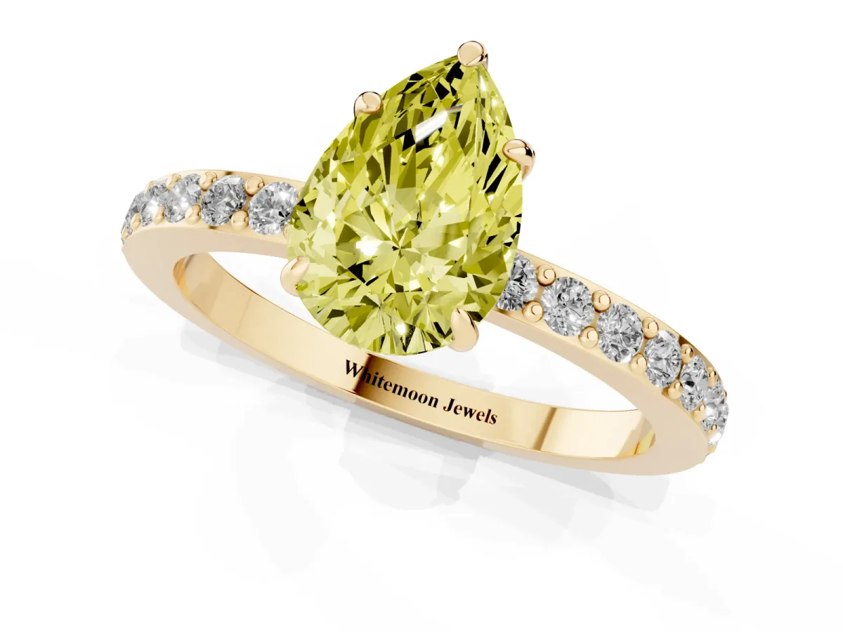 Fancy Yellow Pear Cut Diamond Pavé Engagement Ring with Round Accents and Prong Setting Yellow gold