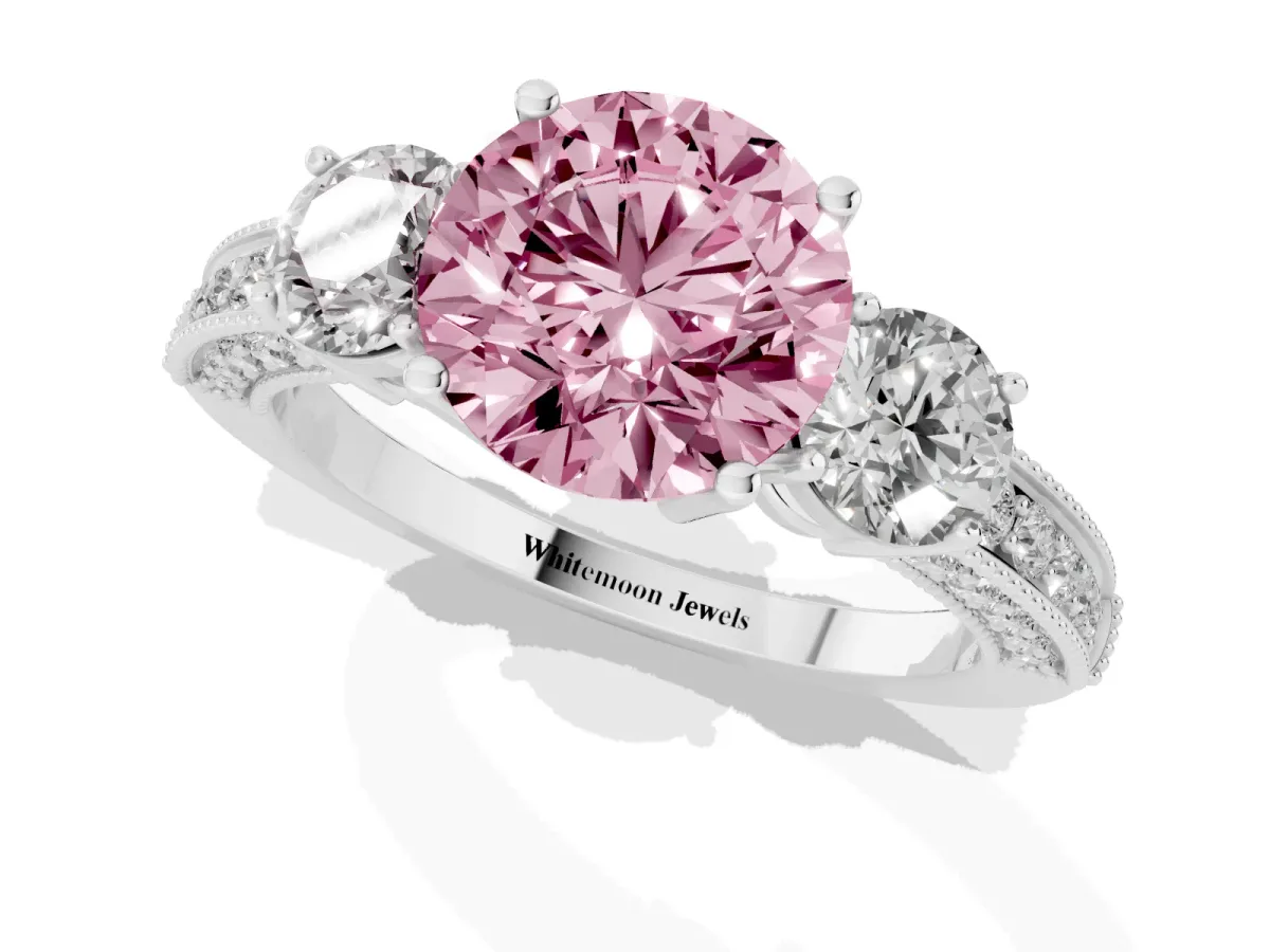 Fancy Pink Round Cut Three-Stone Diamond Ring with Pavé Band and Four-Prong Setting Silver