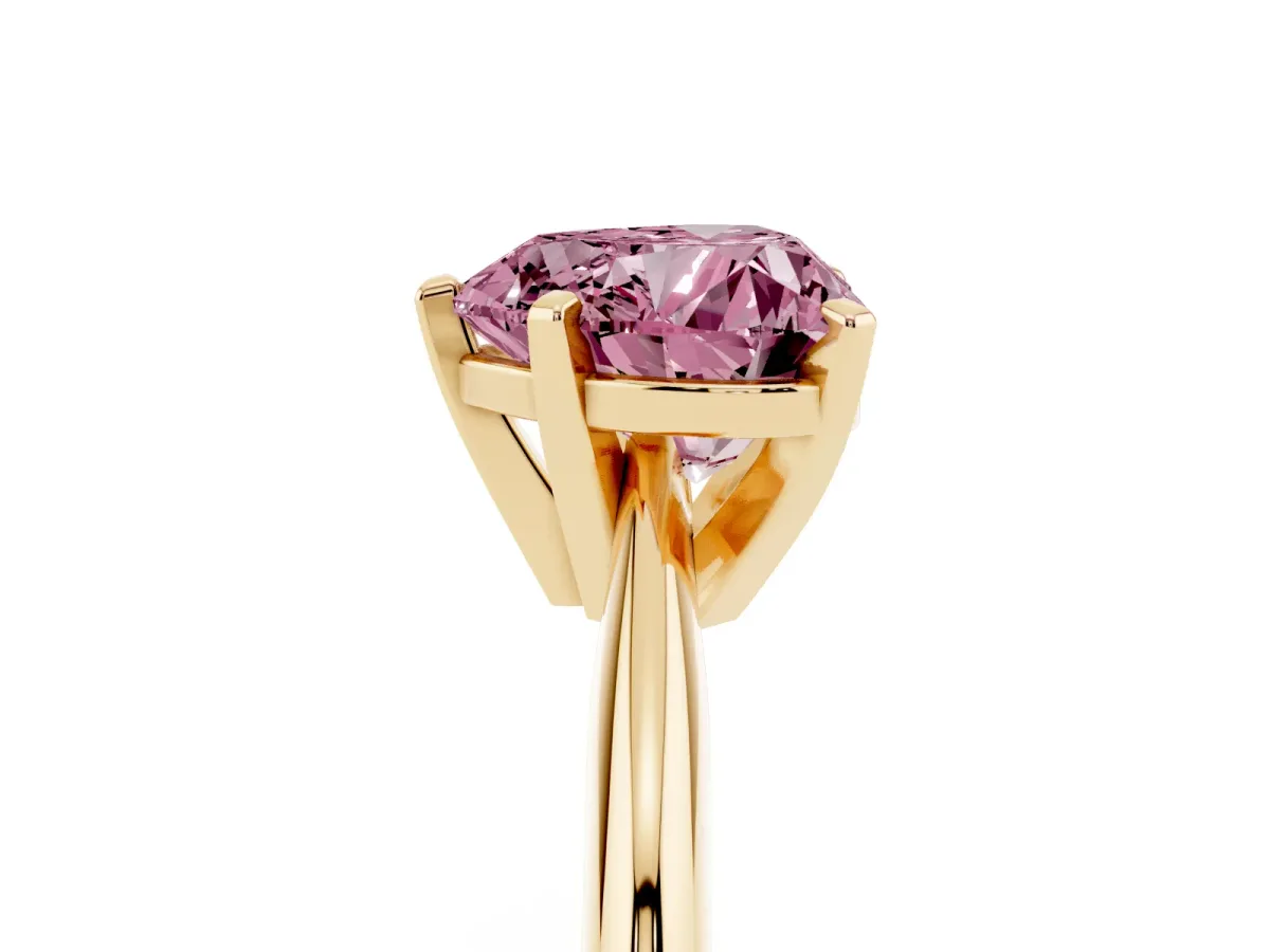 Fancy Pink Heart Cut Cut Solitaire Ring with Four-Prong Setting on a Classic Band Yellow gold