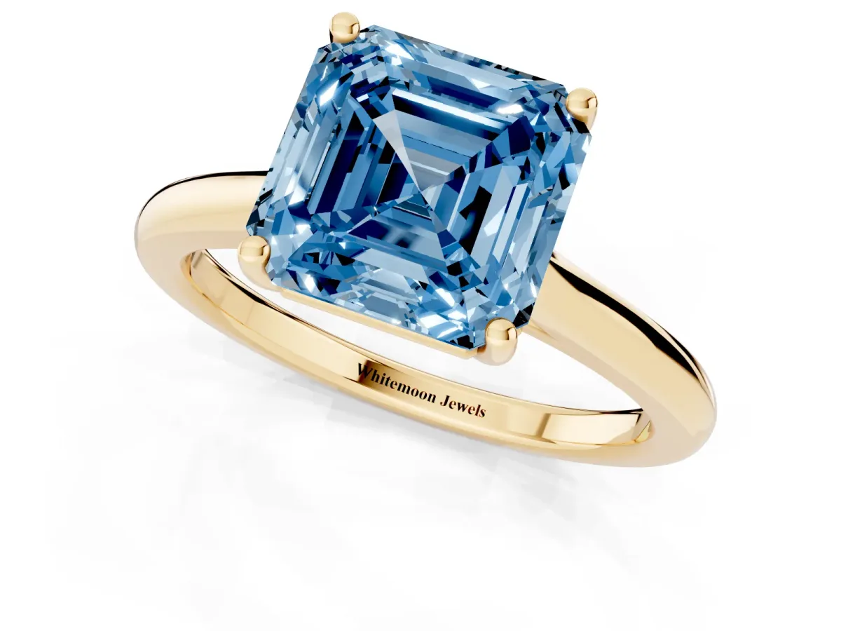 Fancy Blue Asscher Cut Cut Solitaire Ring with Cathedral Band and Four-Prong Setting Yellow gold