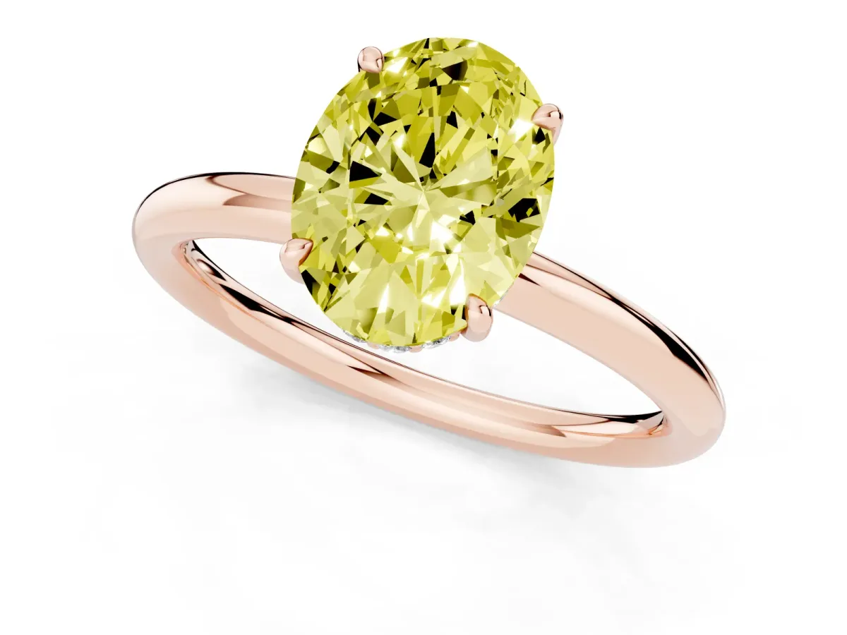 Fancy Yellow Oval Cut Diamond Solitaire Ring with Thin Band and Four-Prong Setting Rose gold