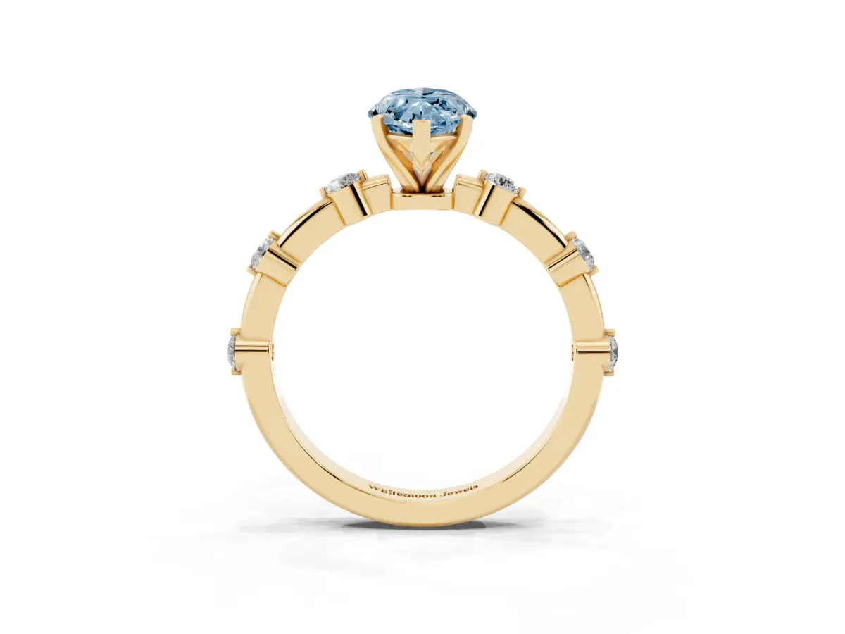 Fancy Blue Marquise Cut Solitaire Diamond Ring with Bezel Set Side Stones and Prong Setting Yellow gold