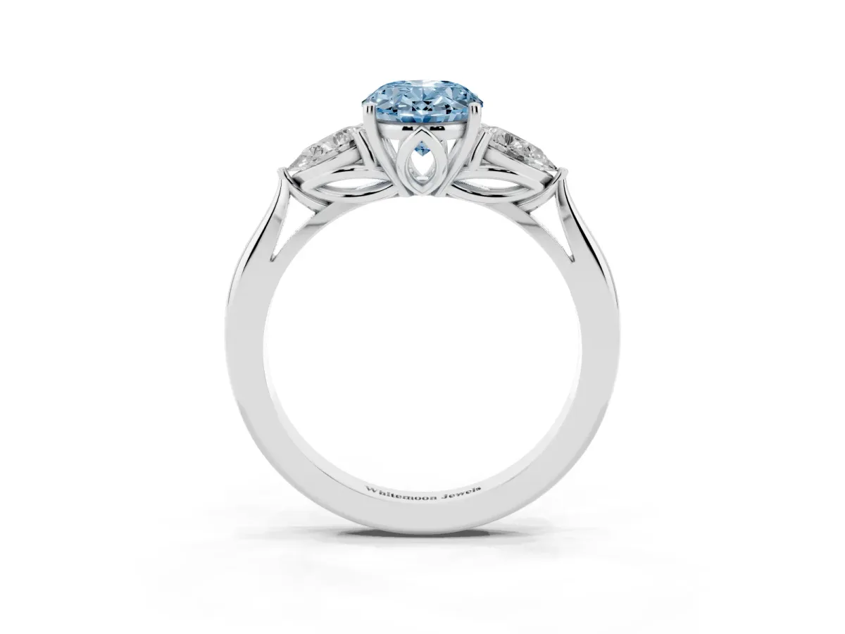 Fancy Blue Three-Stone Oval Cut Diamond Ring with Pear Side Stones in Four-Prong Setting Silver