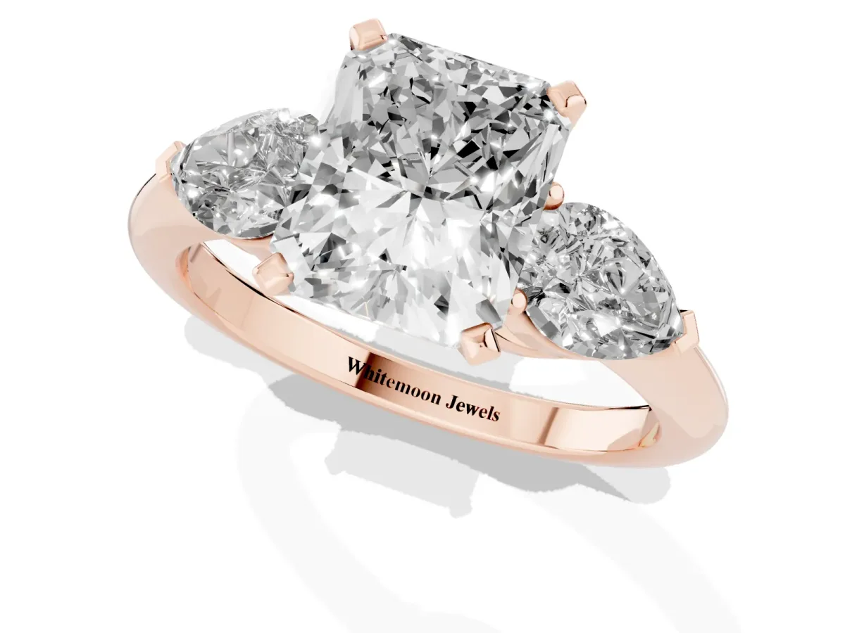 Three-Stone Radiant Cut Diamond Ring with Pear Side Stones and Four-Prong Setting Rose gold