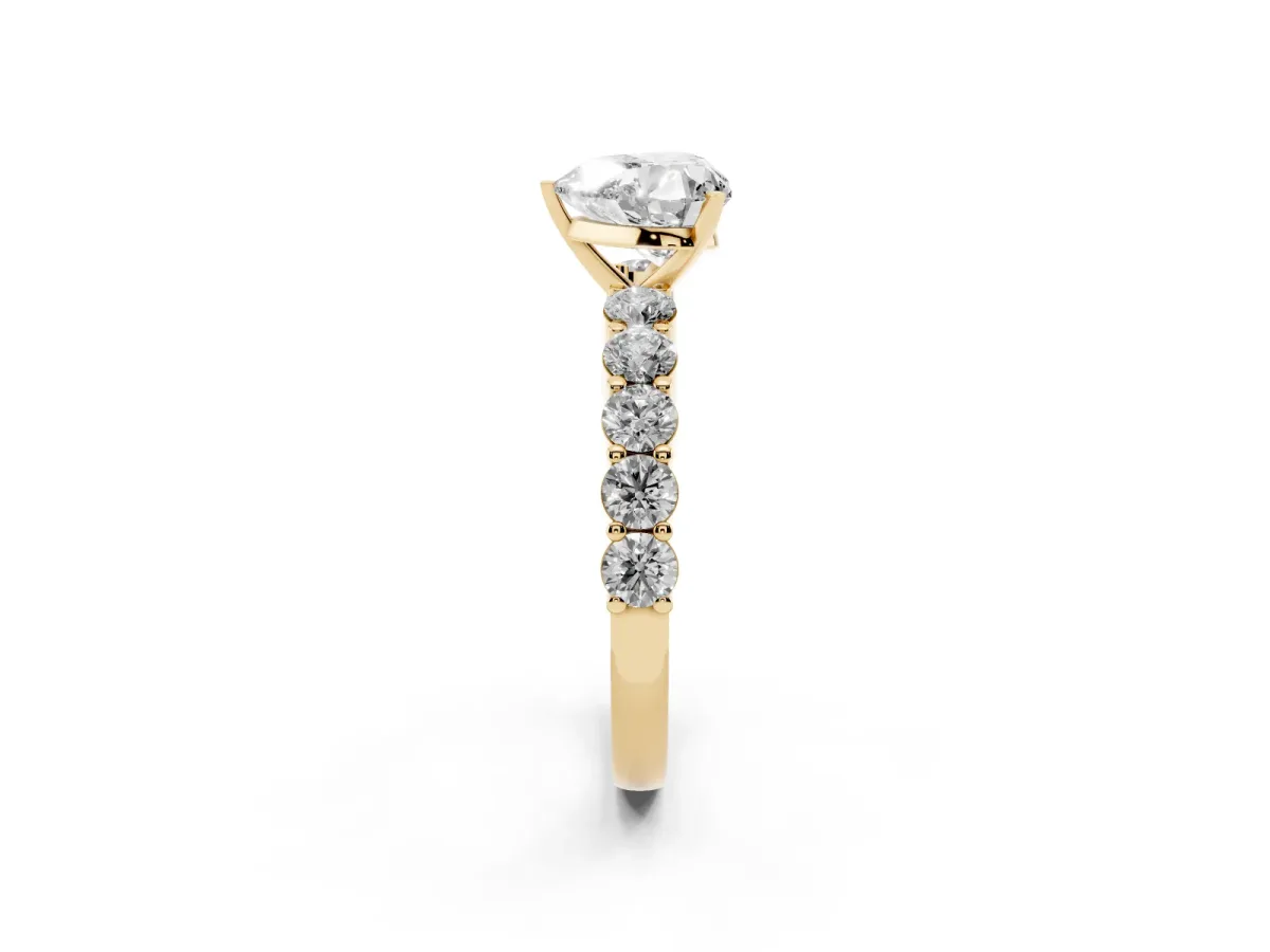 Heart Cut Diamond Solitaire Ring with Shared Prong Round Side Stones Yellow gold