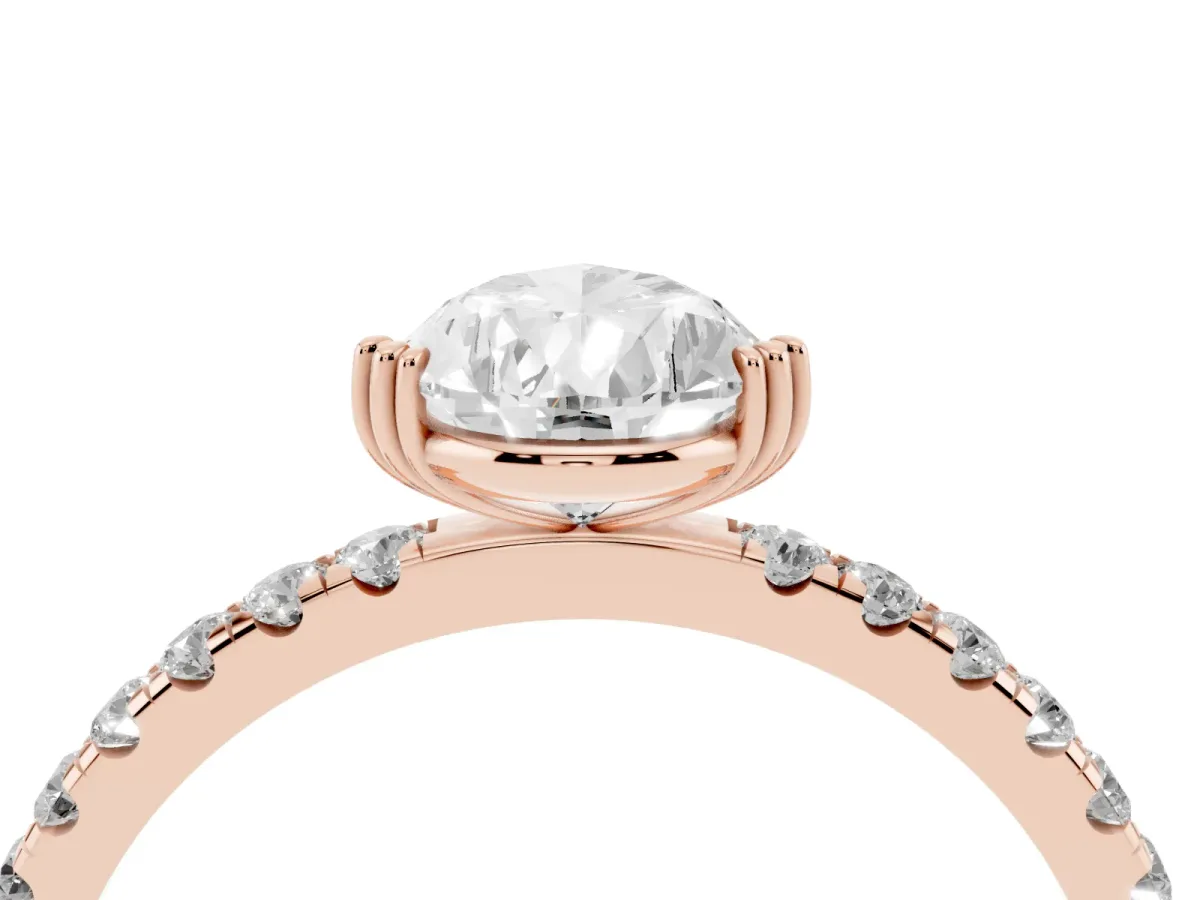 Pear Cut Brilliant Solitaire with Pavé Band and Claw Prong Setting Rose gold