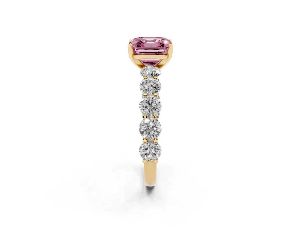 Fancy Pink Asscher Cut Diamond Prong Setting with Side Stones on a Pave Band Yellow gold