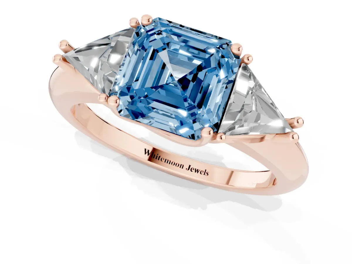 Fancy Blue Three-Stone Asscher Cut Diamond Engagement Ring with Trillion Side Stones and Prong Setting Rose gold
