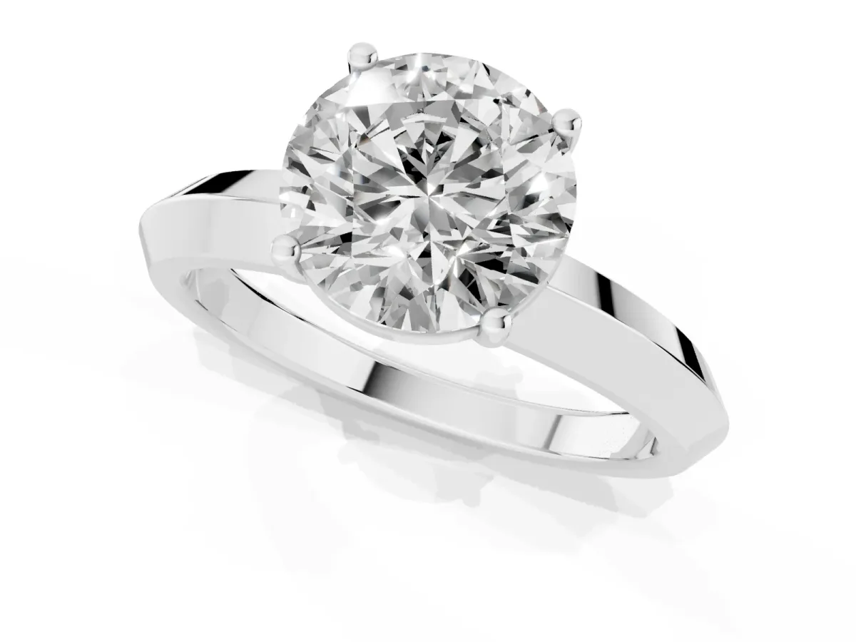 Round Cut Cut Solitaire Engagement Ring with Flat Band and Four-Prong Setting Silver