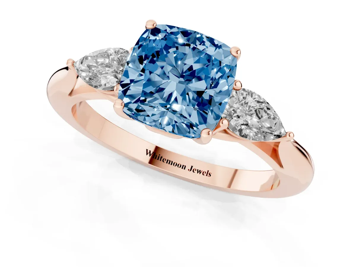 Fancy Blue Three-Stone Cushion Cut Diamond Ring with Pear Side Stones in Four-Prong Setting Rose gold