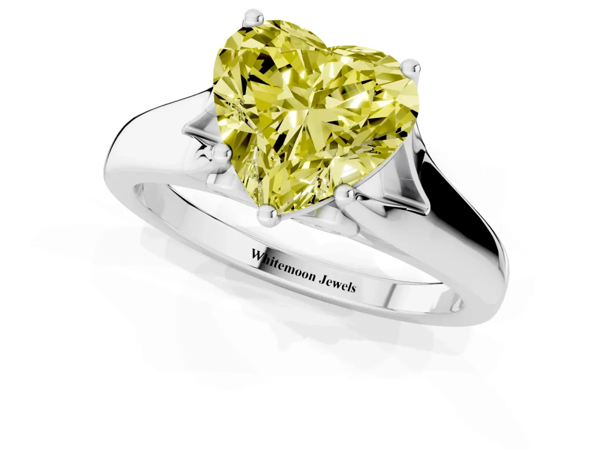 Fancy Yellow Heart Cut Solitaire Diamond Ring with Cathedral Band and Four-Prong Setting Silver