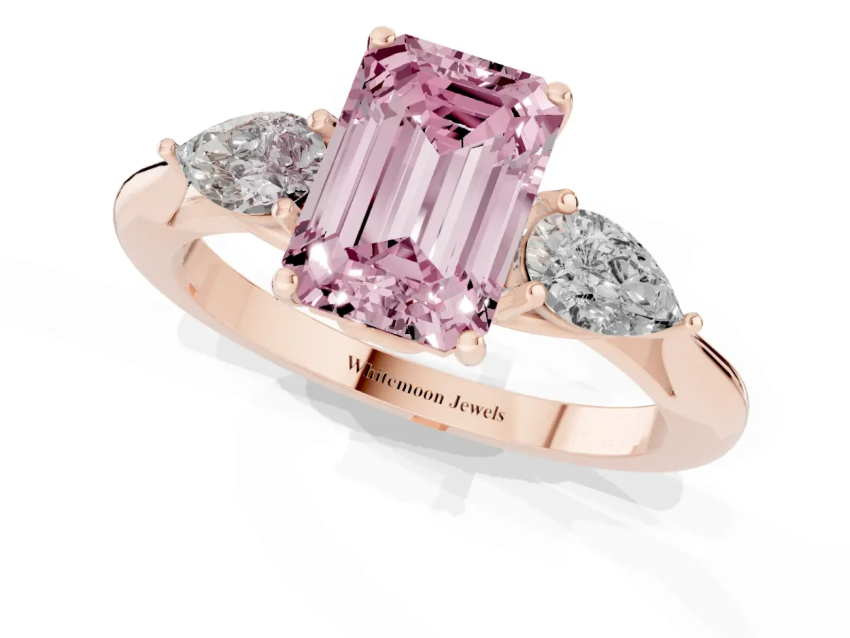 Fancy Pink Three-Stone Emerald Cut Diamond Ring with Pear Side Stones in Four-Prong Setting Rose gold