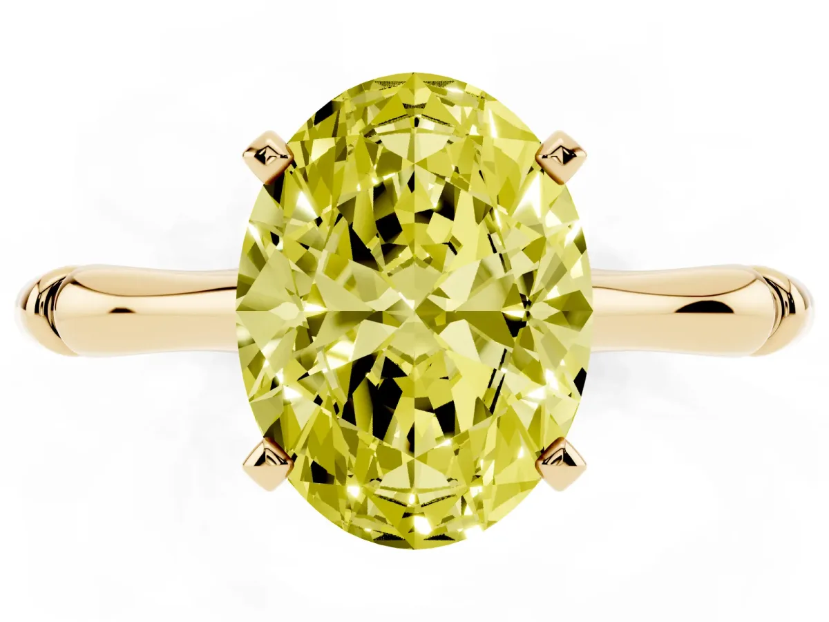 Fancy Yellow Oval Cut Solitaire Diamond Ring with Bamboo Band and Four-Prong Setting Yellow gold