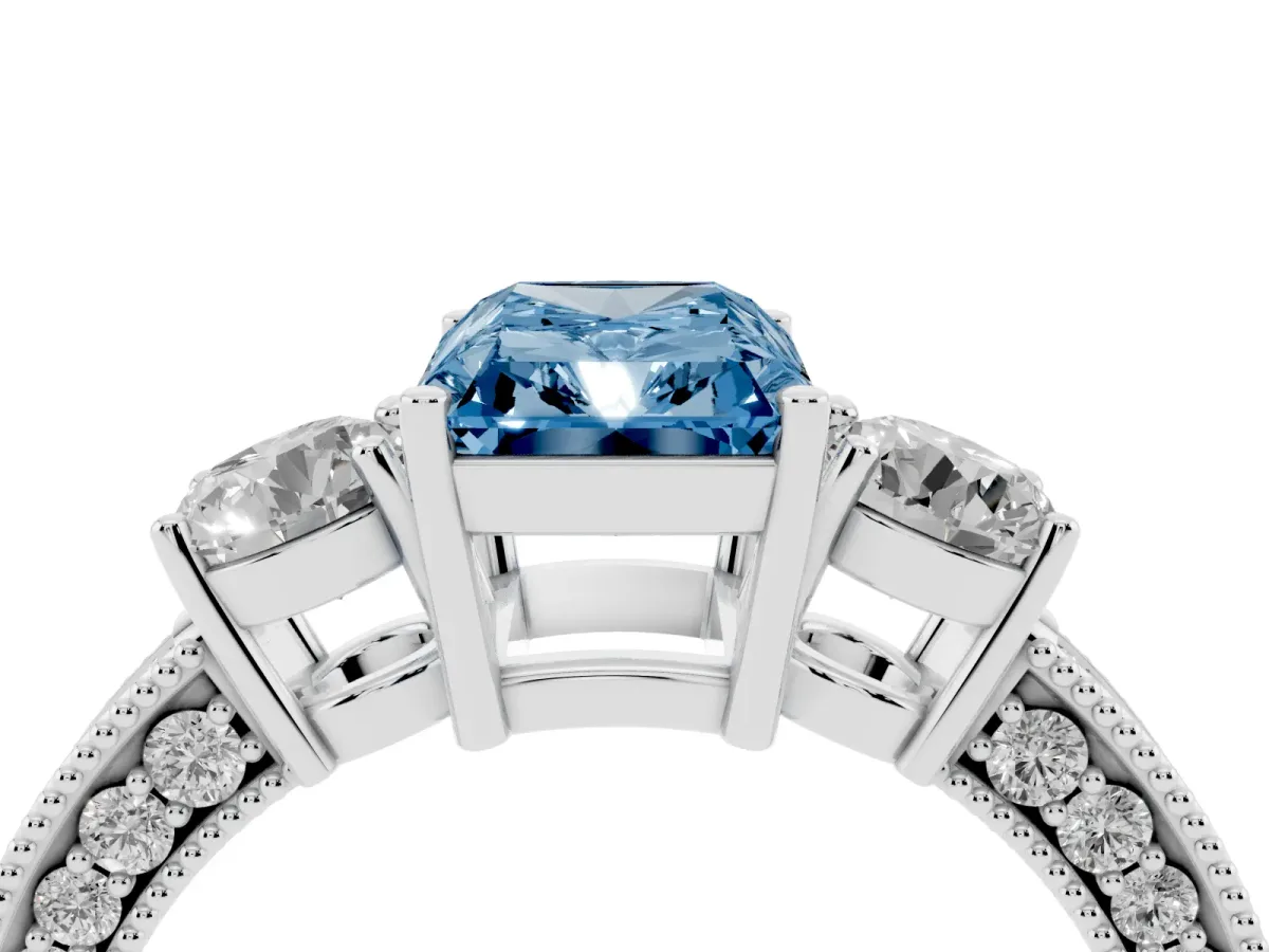 Fancy Blue Radiant Cut Three-Stone Diamond Ring with Pavé Band and Four-Prong Setting Silver