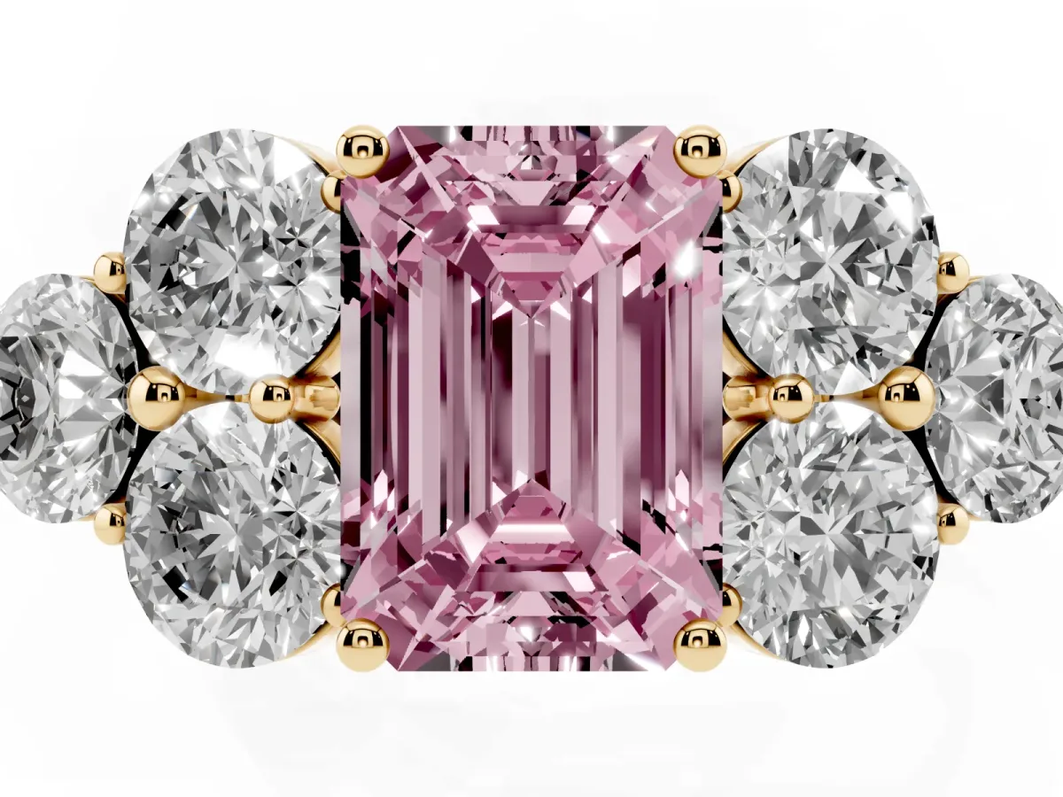 Fancy Pink Emerald Cut Cut Diamond Cluster Ring with Round Accent Stones and Prong Setting on a Classic Band Yellow gold