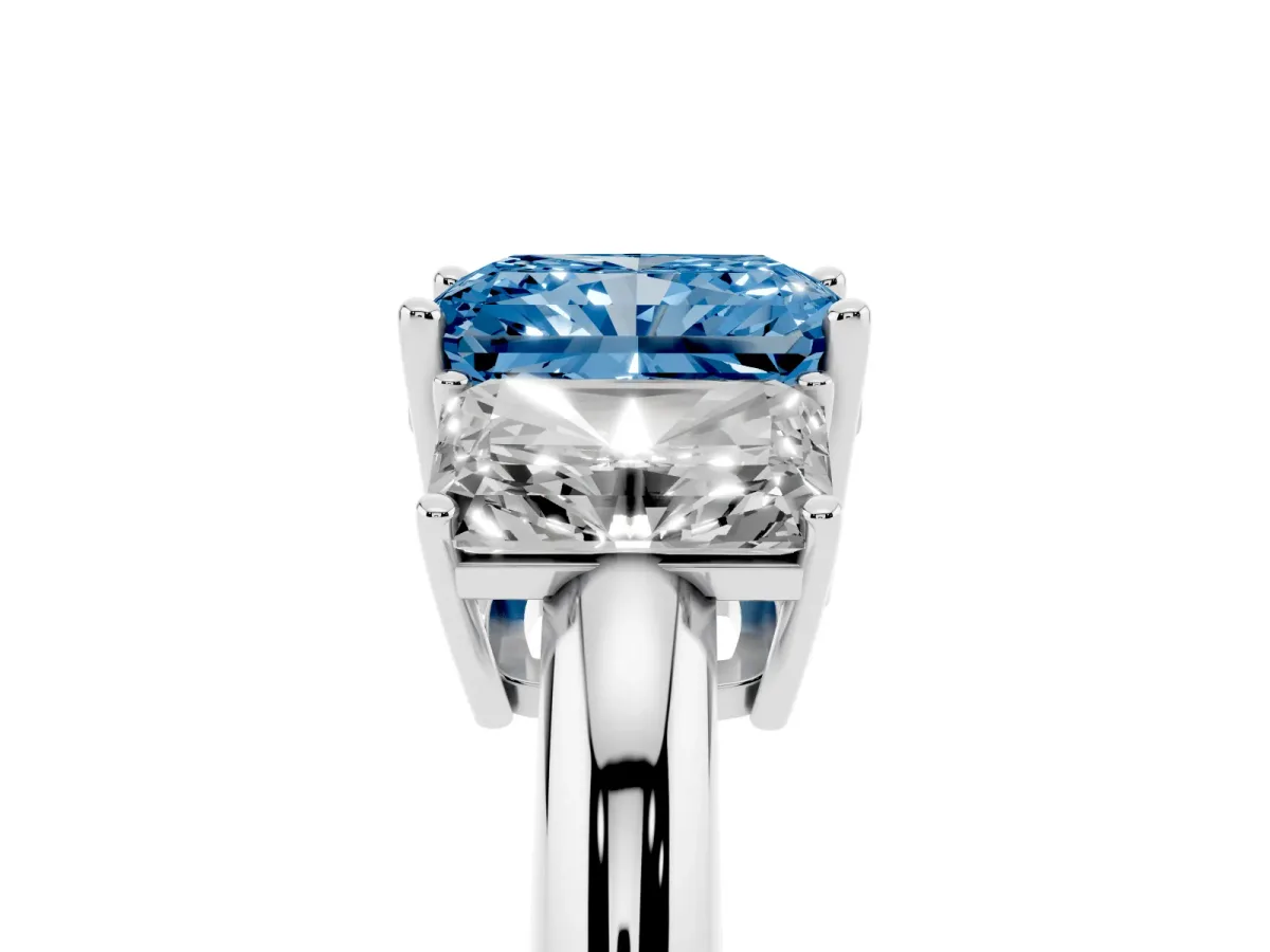 Fancy Blue Three-Stone Radiant Cut Cut Diamond Engagement Ring with Prong Setting on a White Gold Band Silver