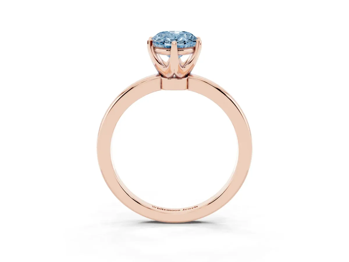 Fancy Blue Oval Cut Solitaire Diamond Ring with Six-Prong Setting on a Classic Band Rose gold