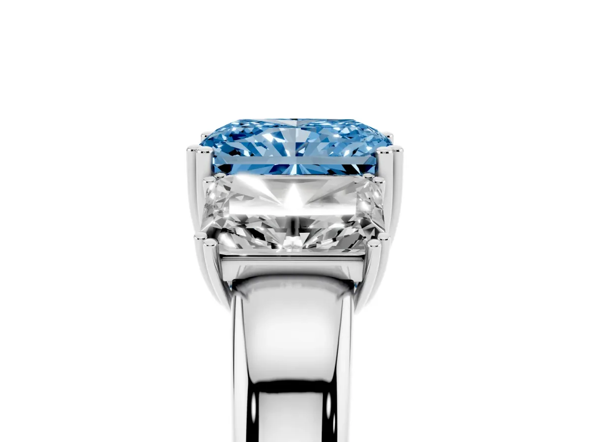 Fancy Blue Three-Stone Radiant Cut Cut Diamond Ring with Channel Set Band and Four-Prong Setting Silver