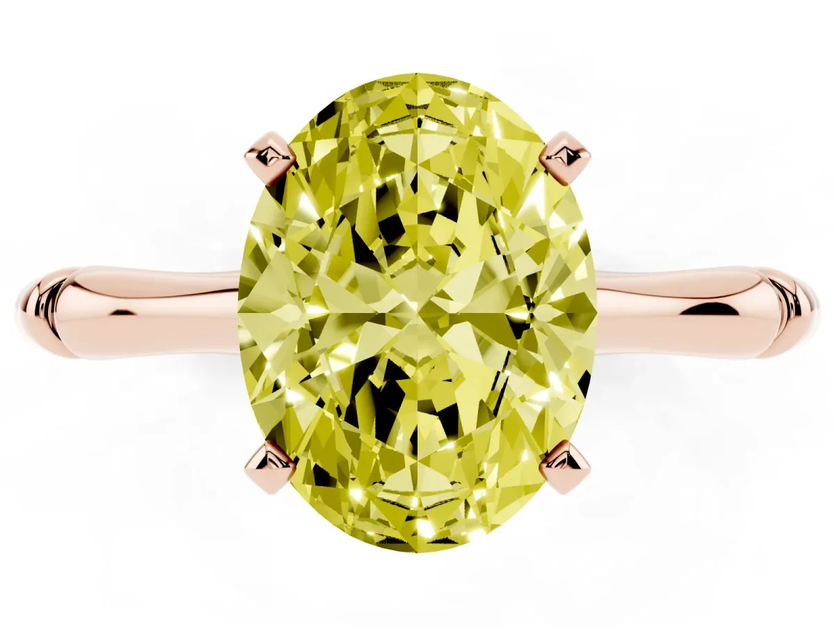 Fancy Yellow Oval Cut Solitaire Diamond Ring with Bamboo Band and Four-Prong Setting Rose gold