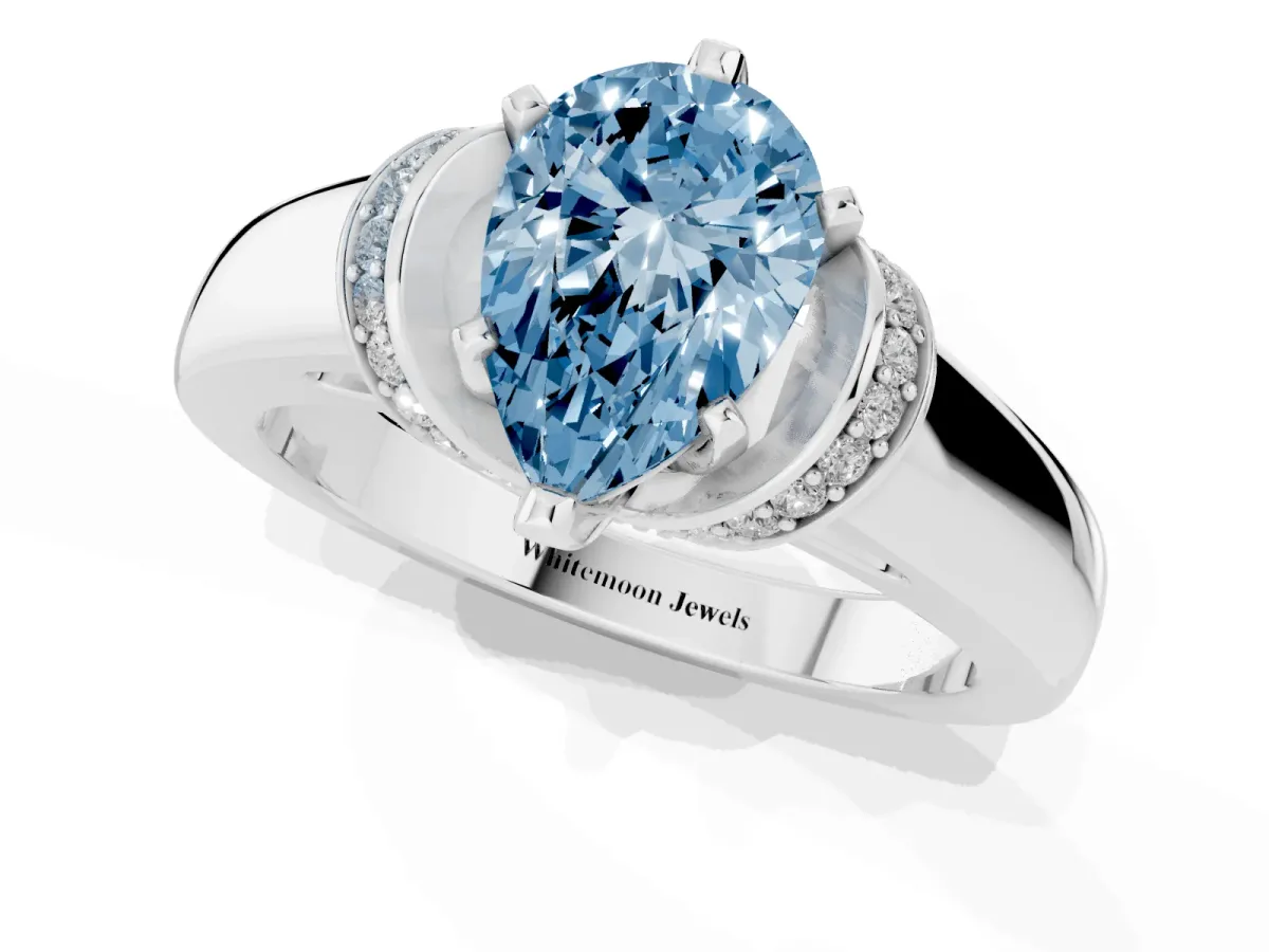 Fancy Blue Pear Cut Solitaire Diamond Ring with Pave Band and Six-Prong Setting Silver