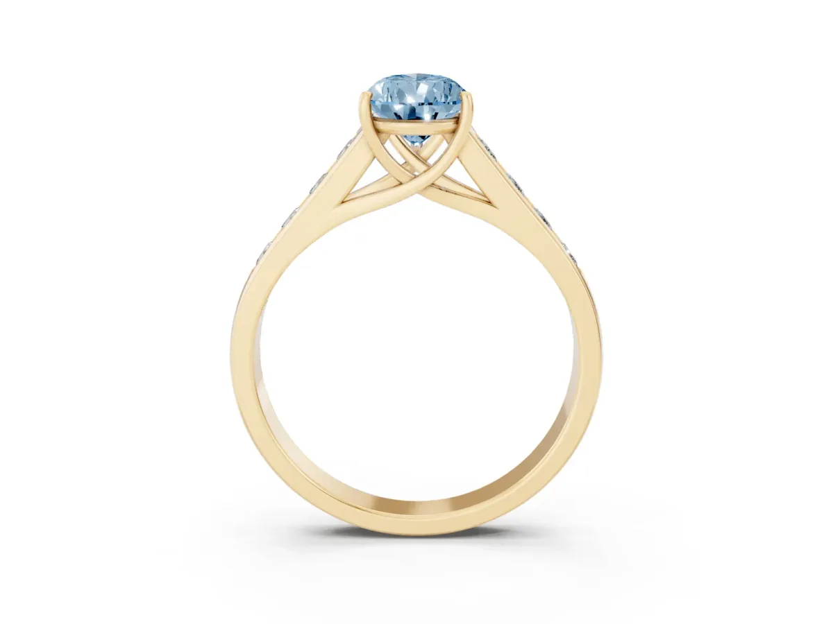 Fancy Blue Pear Cut Brilliant Channel-Set Solitaire Ring with Four-Prong Setting Yellow gold