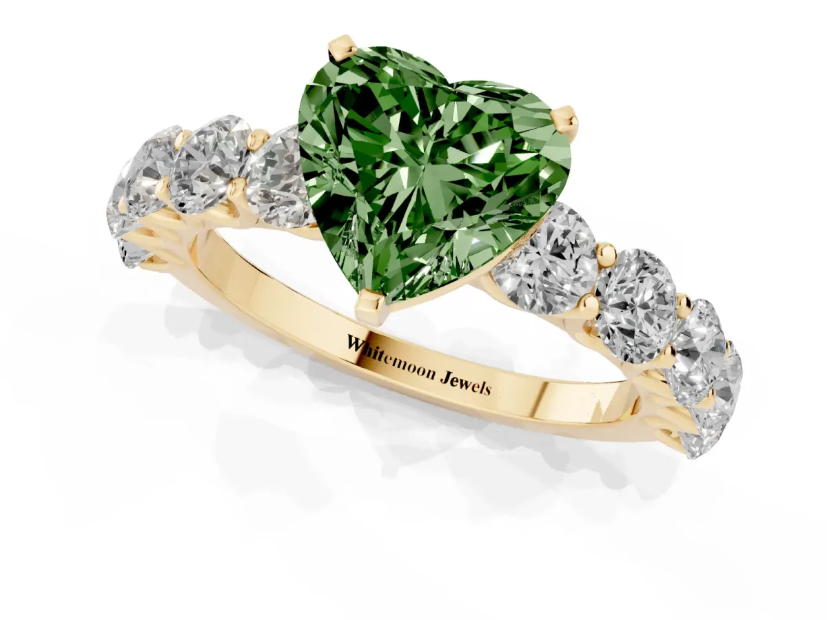 Fancy Green Heart Cut Diamond Prong Setting with Side Stones on a Pave Band Yellow gold